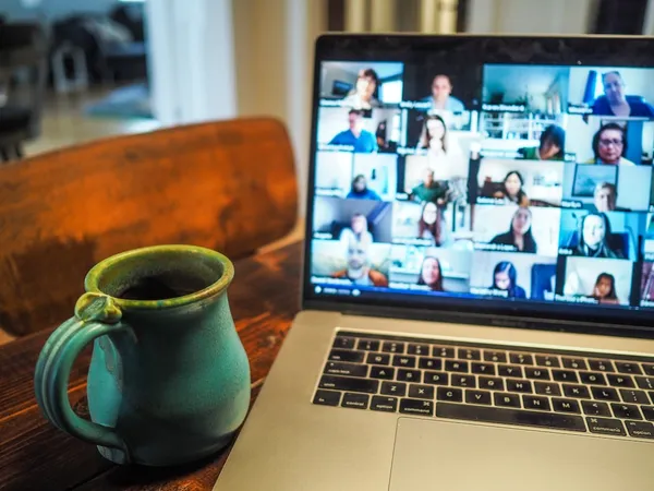 MacBook Pro showing a group video call webinar session